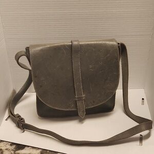 Fashionable leather purse grayish crossbody has scratches